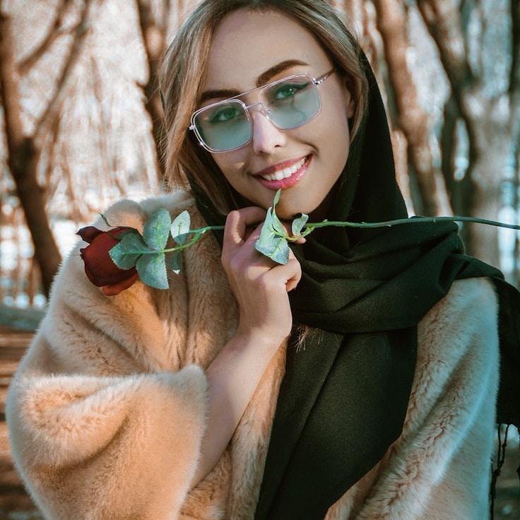 Avery Chen, Lead Design Curator at StarGentleEcho, reviewing corporate floral arrangements